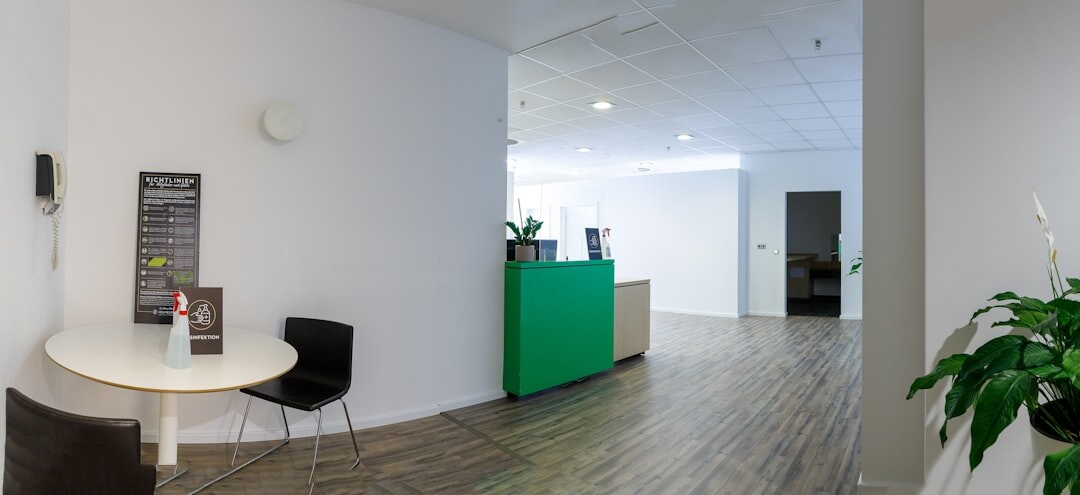 Modern office reception area with seating and plants